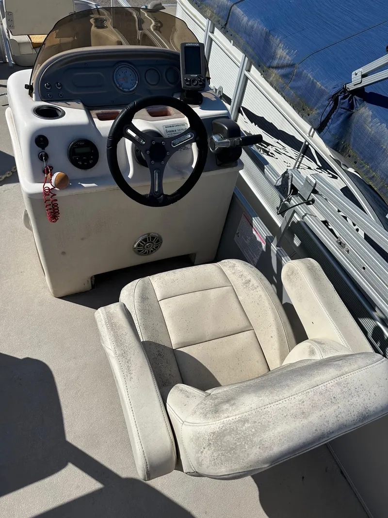 Slide: The Image of 2017 Sun Boatwork Oasis 818 pontoon boat interior with steering console and seat. - 3
