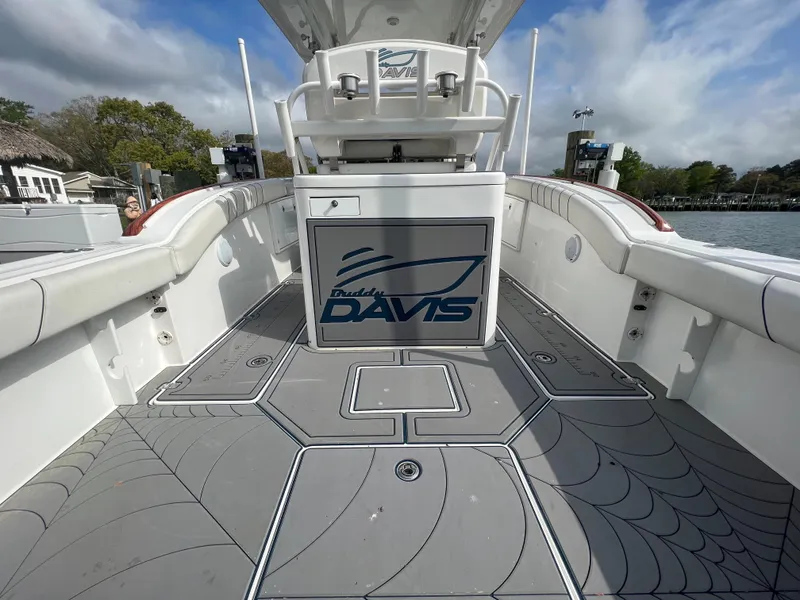Slide: The Image of 2018 Buddy Davis 34 boat deck with logo, white and gray design. - 12