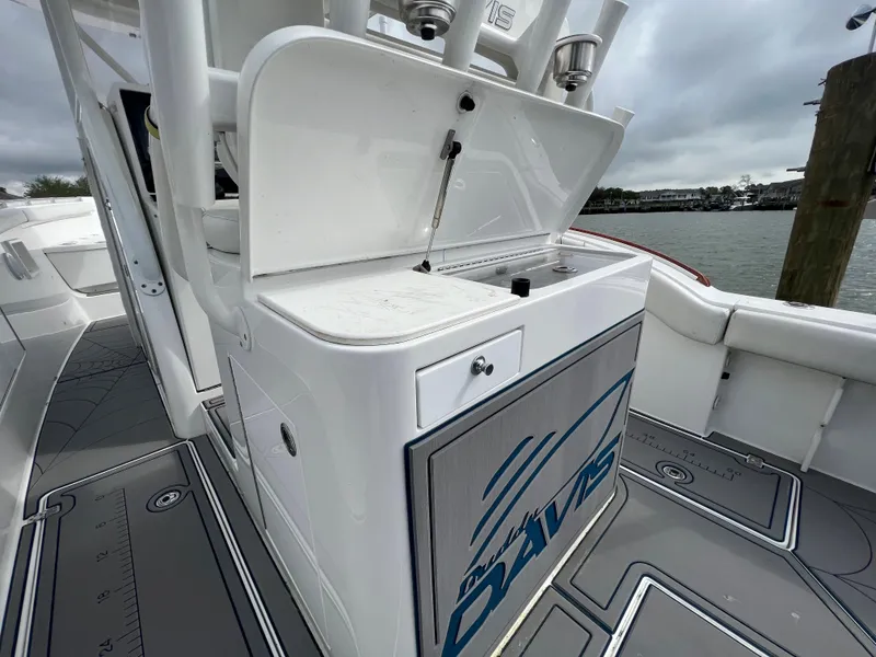 Slide: The Image of 2018 Buddy Davis 34 boat with open storage compartment on deck. - 18