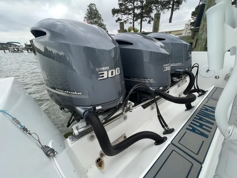Slide: The Image of Triple Yamaha 300 outboard engines on a 2018 Buddy Davis 34 boat. - 22