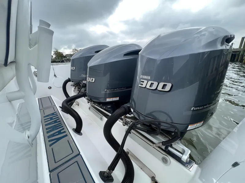 Slide: The Image of Triple Yamaha 300 outboard engines on a 2018 Buddy Davis 34 boat. - 23