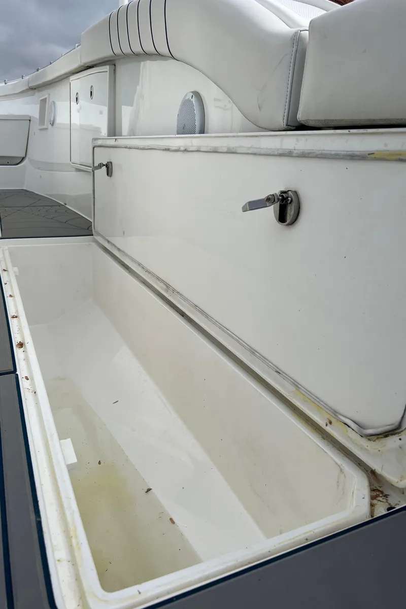 Slide: The Image of Open storage compartment on a 2018 Buddy Davis 34 boat. - 27