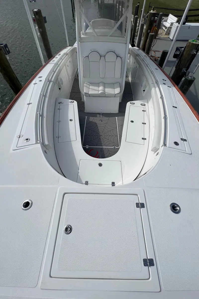 Slide: The Image of 2018 Buddy Davis 34 boat deck with seating and storage compartments. - 28