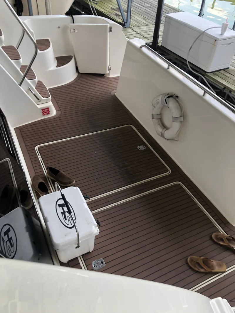 Slide: The Image of Deck of a 2007 Meridian 580 Pilothouse with life ring and sandals. - 10