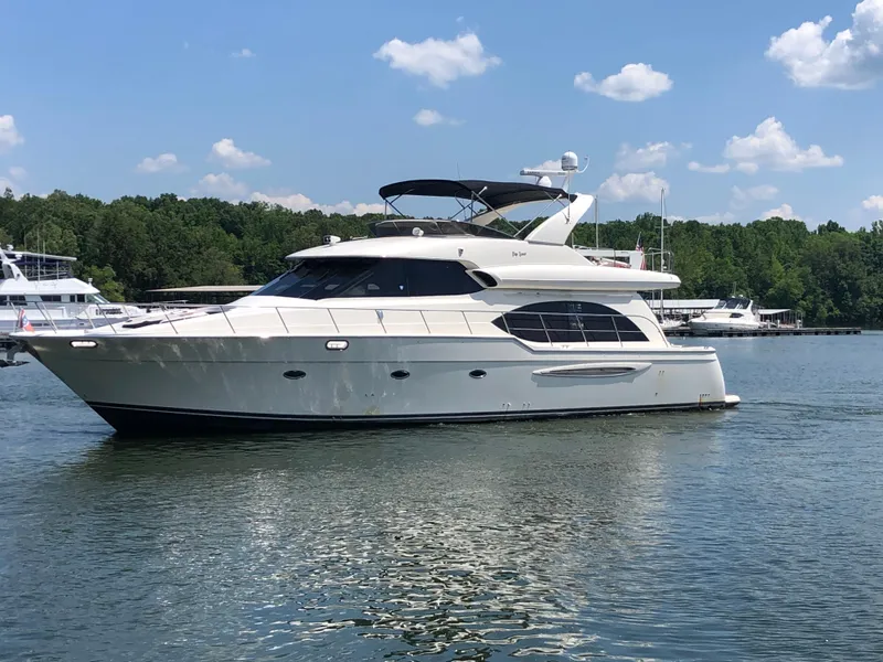 Slide: The Image of 2007 Meridian 580 Pilothouse Yacht on calm water. - 2