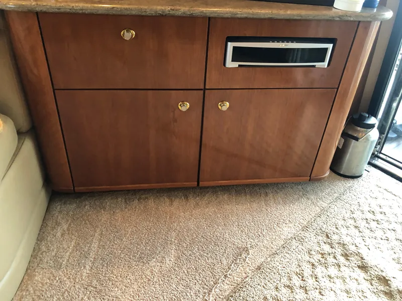 Slide: The Image of Interior of 2007 Meridian 580 Pilothouse with wooden cabinetry. - 23