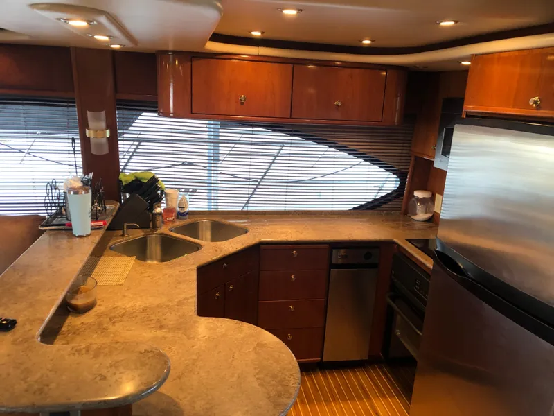 Slide: The Image of Interior of Meridian 580 Pilothouse yacht, kitchen with modern amenities. - 26