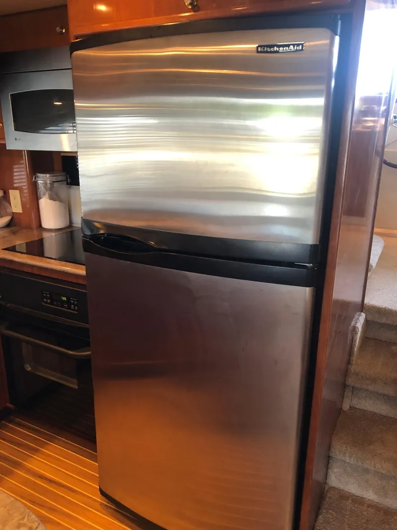 Slide: The Image of Kitchen area of 2007 Meridian 580 Pilothouse yacht with stainless steel appliances. - 29