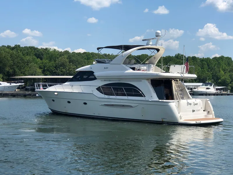 Slide: The Image of 2007 Meridian 580 Pilothouse yacht on a serene lake. - 3