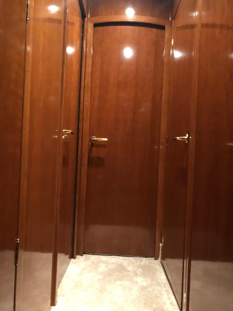 Slide: The Image of Wood-paneled hallway in a 2007 Meridian 580 Pilothouse yacht. - 38