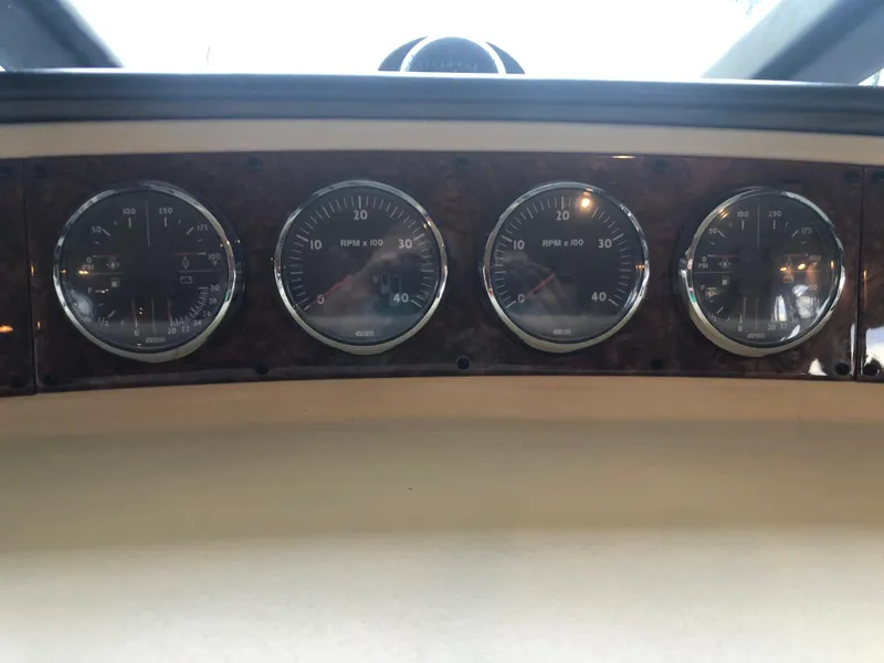 Slide: The Image of Dashboard of a 2007 Meridian 580 Pilothouse with four gauges. - 47