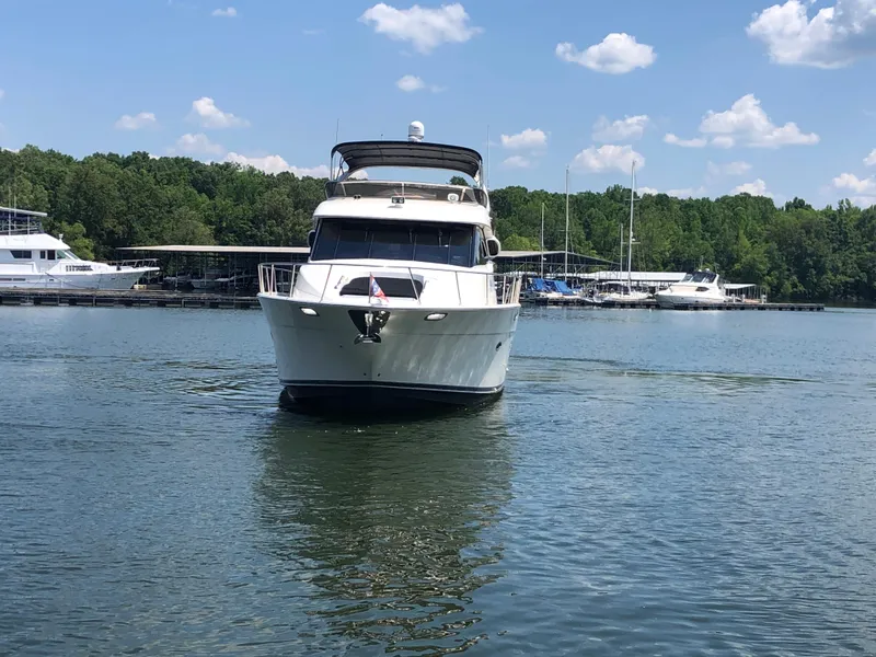 Slide: The Image of 2007 Meridian 580 Pilothouse anchored on calm water. - 9