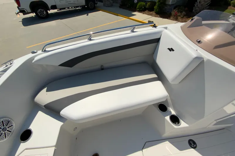 Slide: The Image of 2024 Starcraft SVX 171 boat interior seating area with cup holders. - 16