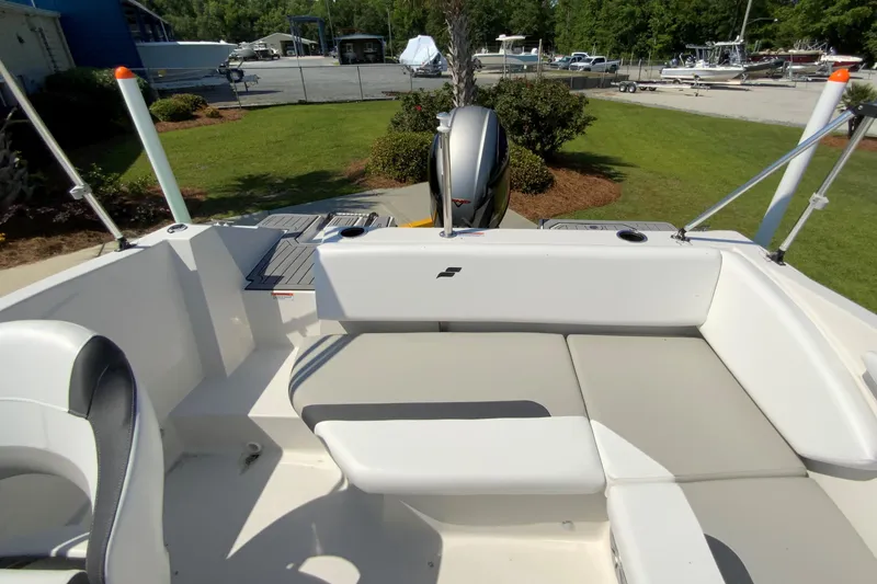 Slide: The Image of 2024 Starcraft SVX 171 boat interior with seating and outboard motor. - 22
