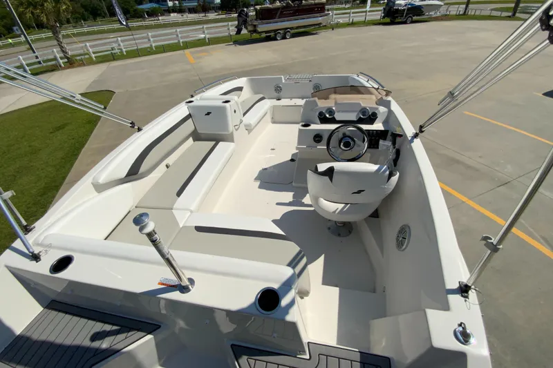 Slide: The Image of 2024 Starcraft SVX 171 boat interior with seating and steering console. - 7