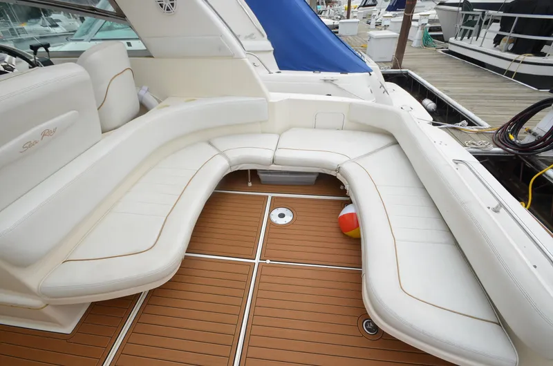 Slide: The Image of 1998 Sea Ray 310 boat with white seating and teak deck. - 7