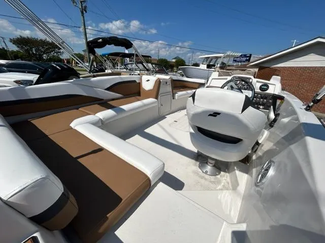 Slide: The Image of 2024 Starcraft SVX 191 boat interior with white and brown seating. - 12