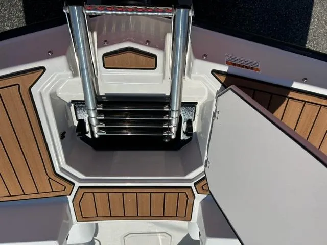 Slide: The Image of 2024 Starcraft SVX 191 boat with open storage compartment and ladder. - 4