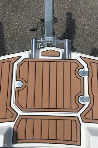 Slide: The Image of 2024 Starcraft SVX 211 boat deck with brown and white design. - 11