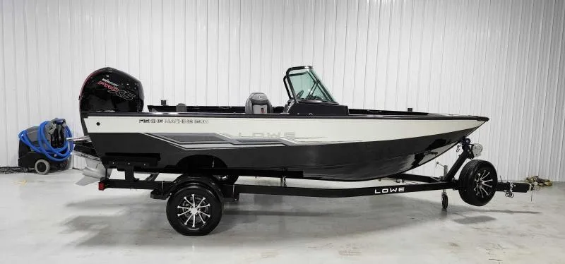 Slide: The Image of 2023 Lowe FM18PW fishing boat on trailer in a garage. - 9