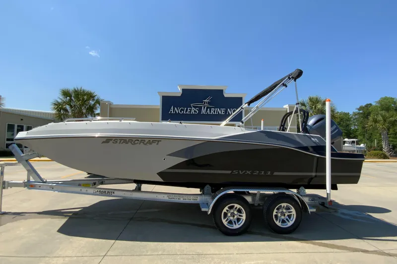 The Image of 2024 Starcraft SVX 211 boat on trailer at Angler's Marine dealership. - 0