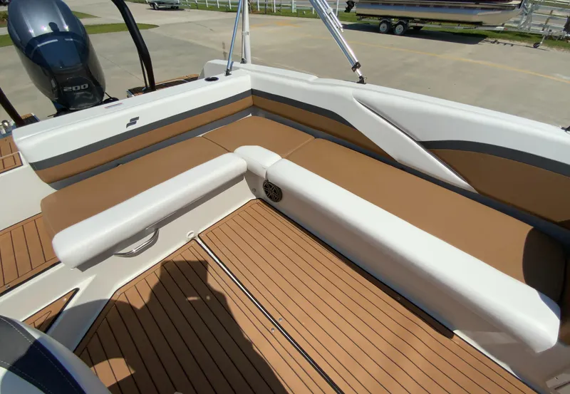 Slide: The Image of 2024 Starcraft SVX 211 boat interior with tan and white seating. - 10