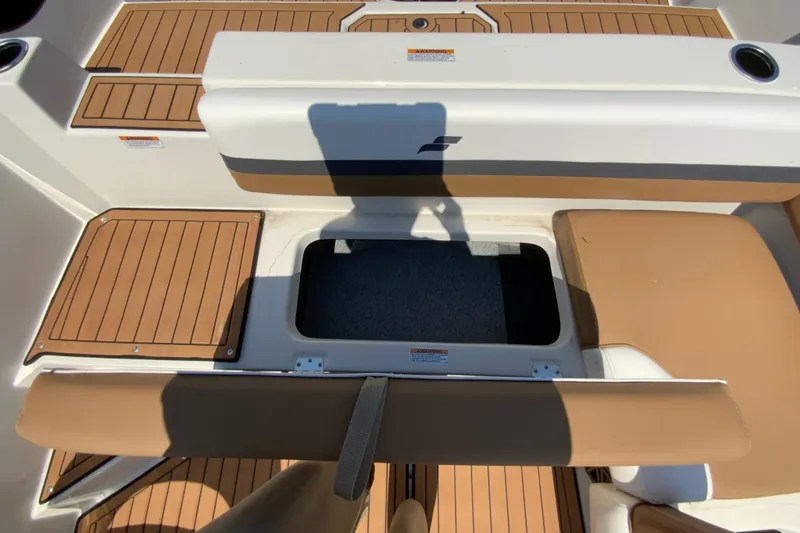 Slide: The Image of 2024 Starcraft SVX 211 boat interior with open storage compartment. - 13