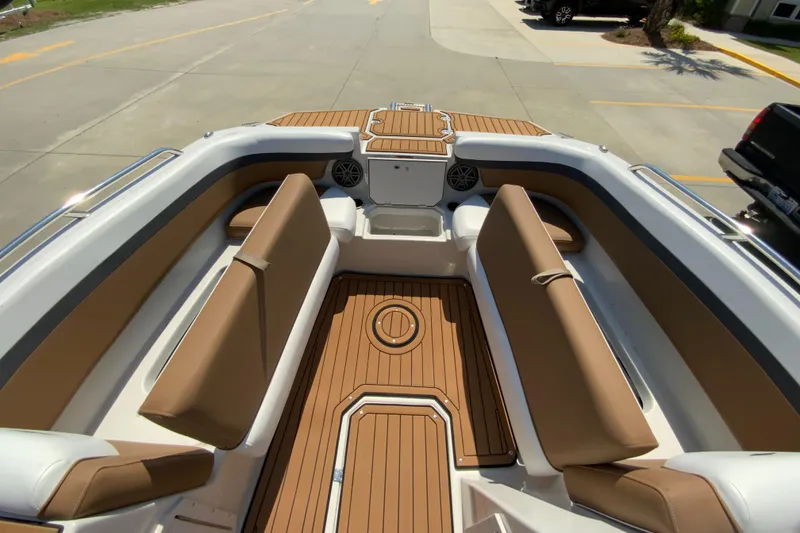 Slide: The Image of 2024 Starcraft SVX 211 boat interior with tan seating and teak flooring. - 15