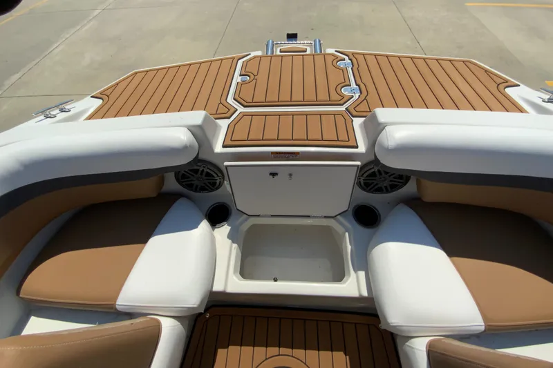 Slide: The Image of 2024 Starcraft SVX 211 boat interior with tan and white seating. - 17
