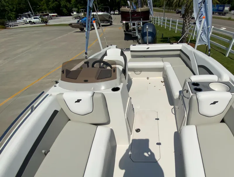 Slide: The Image of 2024 Starcraft SVX 211 boat interior with seating and steering console. - 4