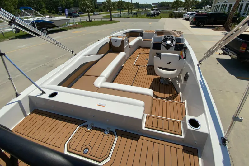 Slide: The Image of 2024 Starcraft SVX 211 boat interior with tan and white seating. - 7