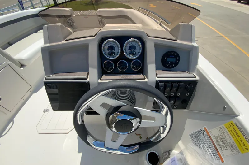 Slide: The Image of 2024 Starcraft SVX 191 boat dashboard with steering wheel and instrument panel. - 15