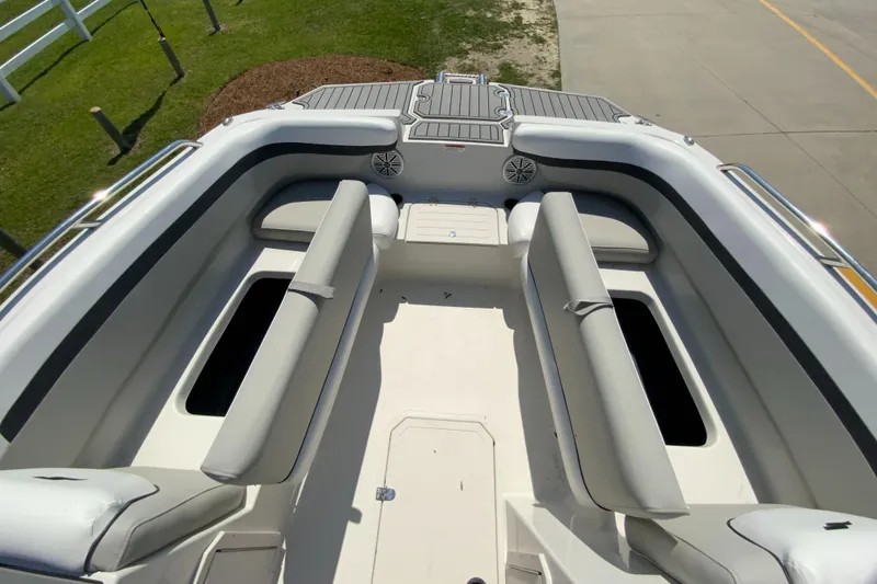 Slide: The Image of 2024 Starcraft SVX 191 boat interior with cushioned seating and storage compartments. - 22