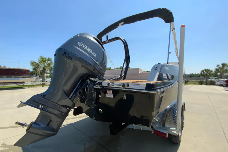 Slide: The Image of 2024 Starcraft SVX 191 boat with Yamaha outboard motor, rear view. - 6