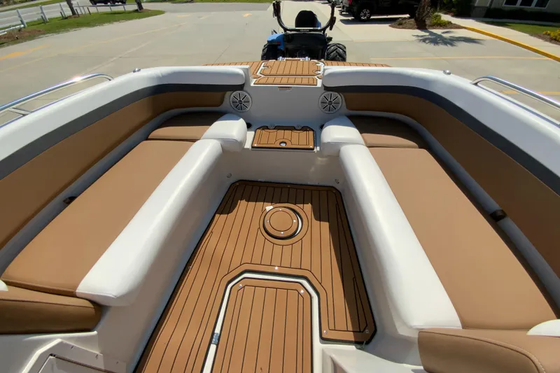 Slide: The Image of 2024 Starcraft SVX 191 boat interior with tan seating and teak flooring. - 17