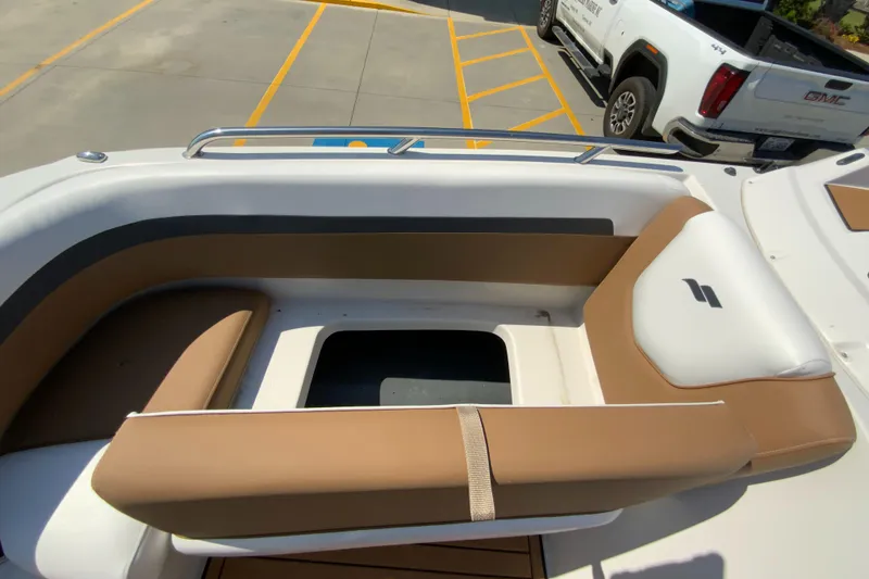 Slide: The Image of 2024 Starcraft SVX 191 boat interior with tan and white seating. - 21