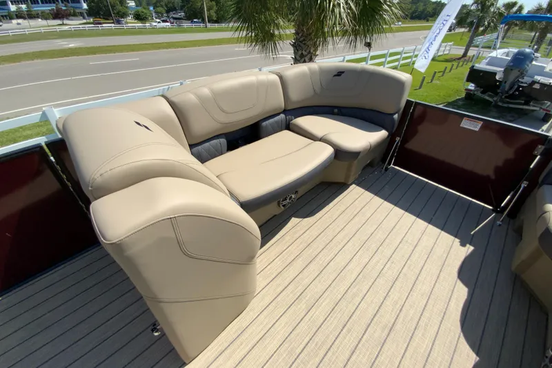 Slide: The Image of 2024 Starcraft SLS 3 boat with beige seating and wooden deck. - 16