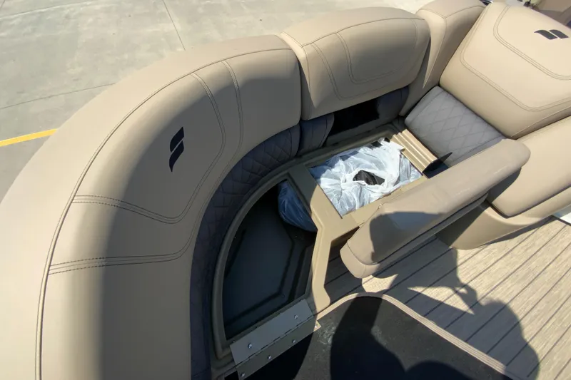 Slide: The Image of 2024 Starcraft SLS 3 boat interior with beige seating and storage compartment. - 19