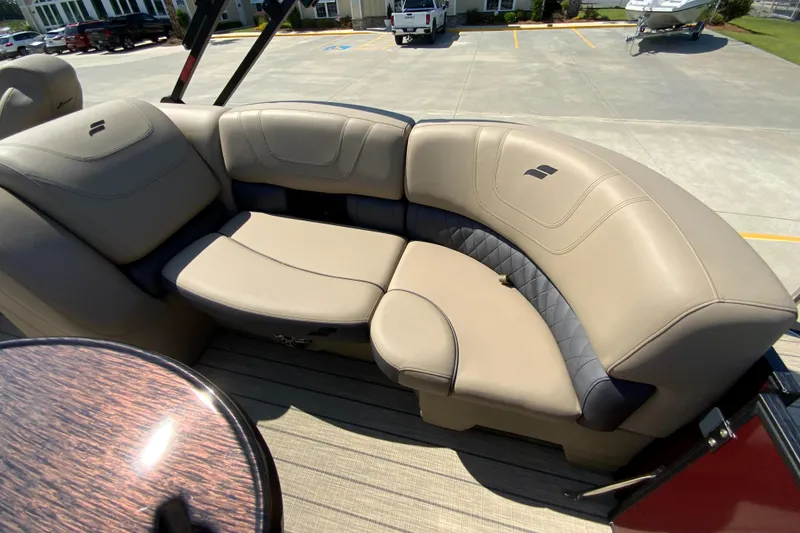Slide: The Image of 2024 Starcraft SLS 3 boat with beige leather seating in a marina. - 6