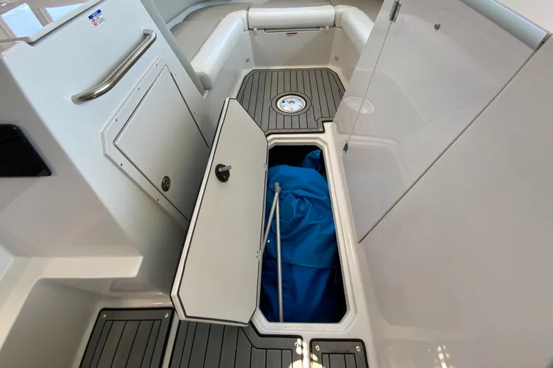 Slide: The Image of 2024 Starcraft SVX 231 boat interior storage compartment. - 12