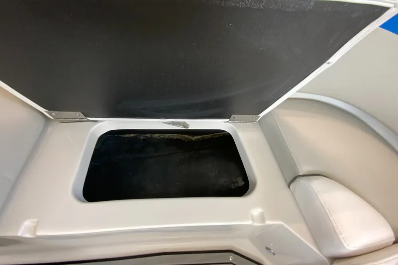 Slide: The Image of Open storage compartment in 2024 Starcraft SVX 231 boat. - 24