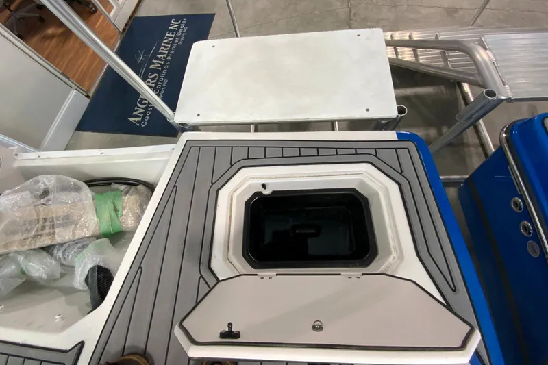 Slide: The Image of 2024 Starcraft SVX 231 boat storage compartment and deck area. - 5