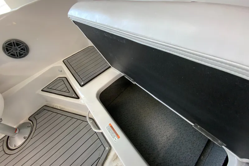 Slide: The Image of 2024 Starcraft SVX 231 boat interior storage compartment and seating. - 7