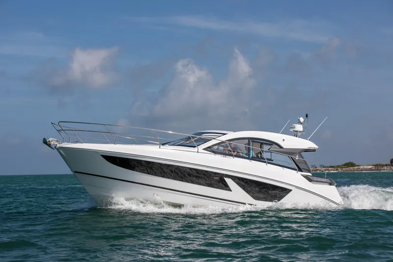 Slide: The Image of 2023 Beneteau Gran Turismo 41 yacht cruising on open water. - 24