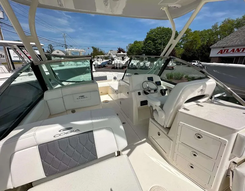 Slide: The Image of 2023 Cobia 240 Dual Console boat interior with seating and helm station. - 3