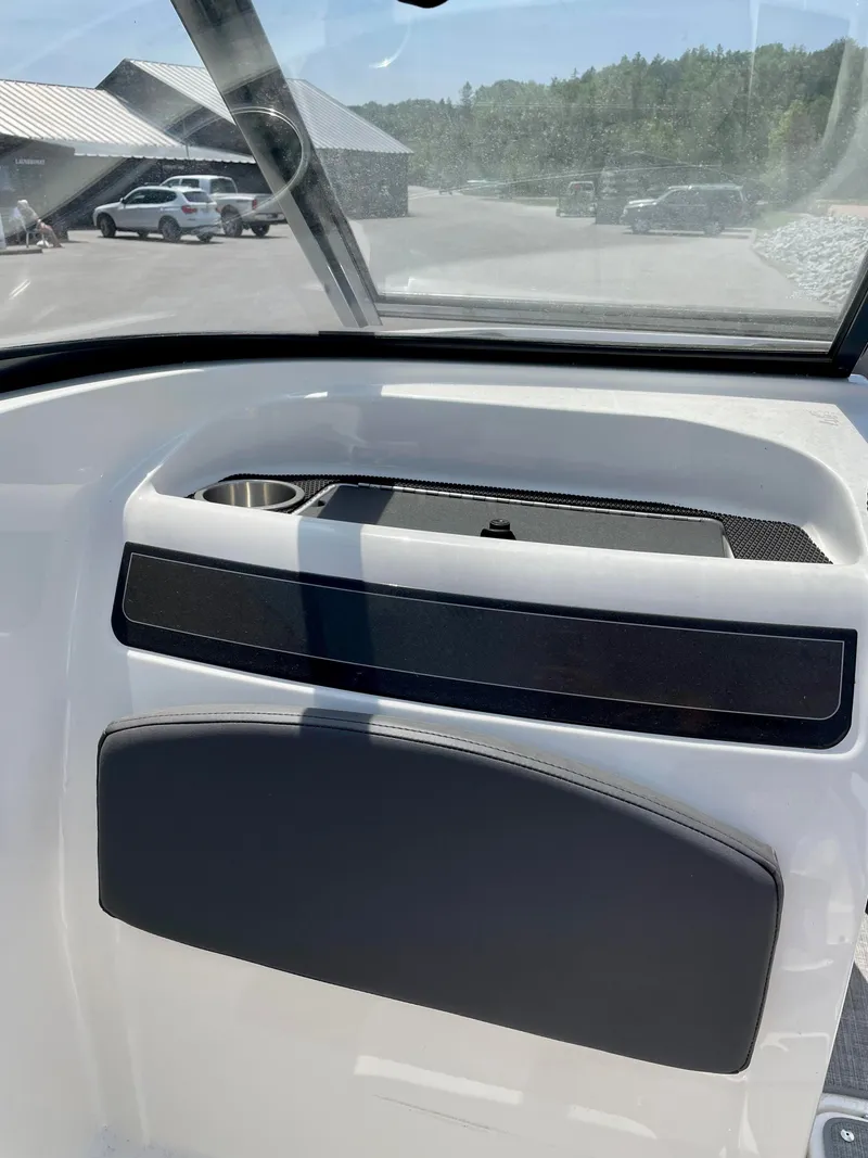 Slide: The Image of 2021 Bayliner VR5 boat interior with dashboard and windshield view. - 17