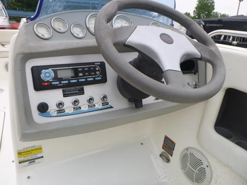 Slide: The Image of 2007 Bayliner 197 Deck Boat steering console with gauges and controls. - 8