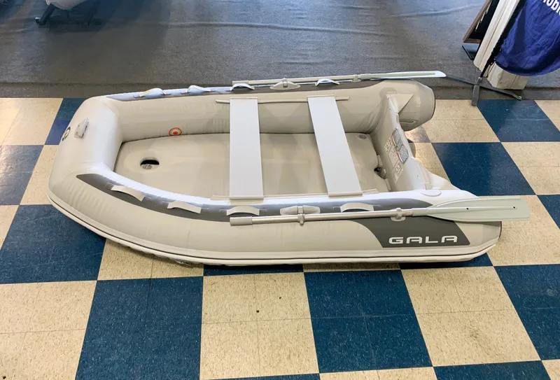 The Image of 2023 Gala F240 inflatable boat on checkered floor. - 1