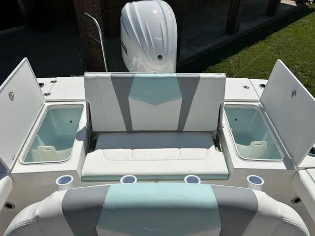 Slide: The Image of 2024 Robalo 246 Cayman boat with seating and storage compartments. - 16