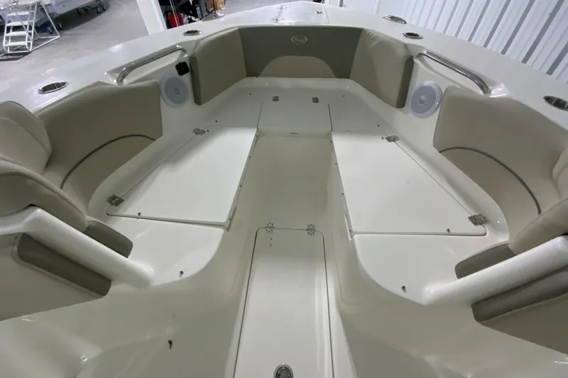 Slide: The Image of 2024 Key West 263 FS boat interior with seating and storage compartments. - 22